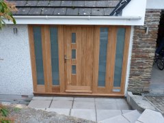 oak door with viewing panels and sidelights