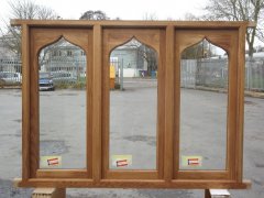 traditional hand crafted arched curved casement window