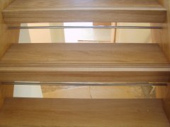 Oak Treads Feature Groove Stainless Steel Riser Bars